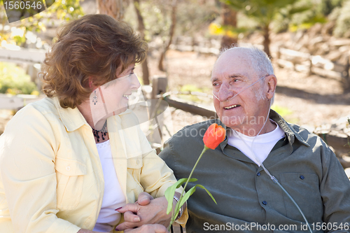 Image of Senior Woman with Man Wearing Oxygen Tubes