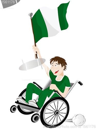 Image of Nigeria Sport Fan Supporter on Wheelchair with Flag