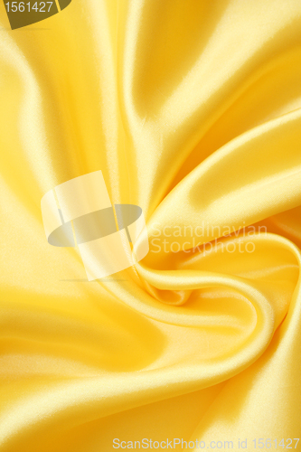 Image of Smooth elegant golden silk as background 