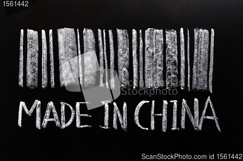 Image of Bar code of "Made in China"written with chalk on a blackboard