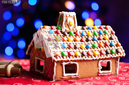 Image of Gingerbread house decorated with colorful candies