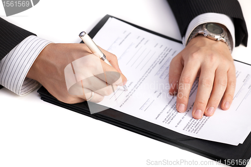 Image of Businessman signing a contract