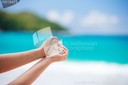 Image of Closeup of woman hands form heart shape