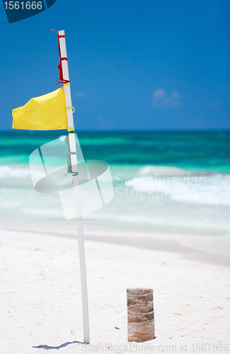 Image of Yellow warning flag at beach