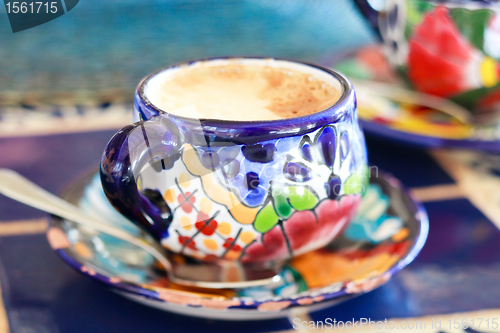 Image of Cappuccino served in colorful cup