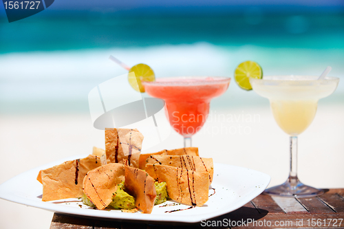 Image of Tortilla chips and margarita cocktails