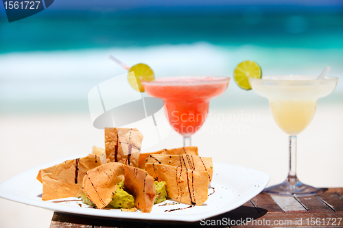 Image of Tortilla chips and margarita cocktails