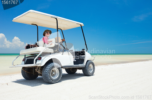 Image of Golf cart at tropical beach