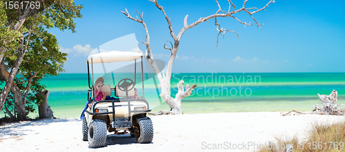 Image of Golf cart at tropical beach