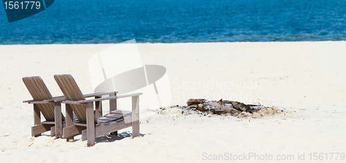 Image of Wooden chairs at tropical beach panorama