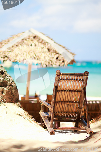 Image of Wooden beach chair on exotic beach