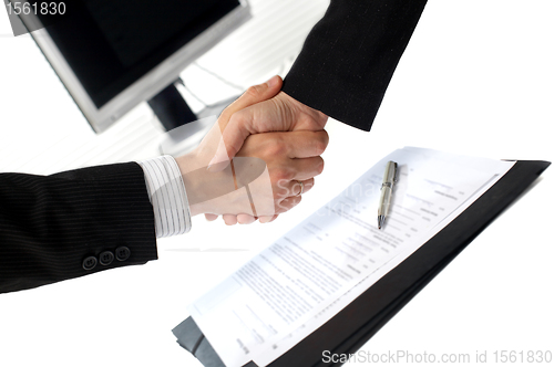 Image of Businesspeople shaking hands