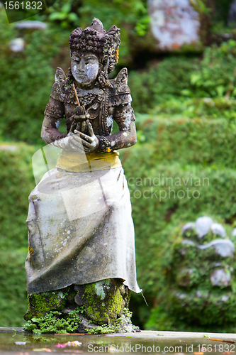 Image of Old beautiful stone Balinese statue
