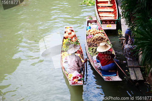 Image of Two vendor on floating market in Thailand