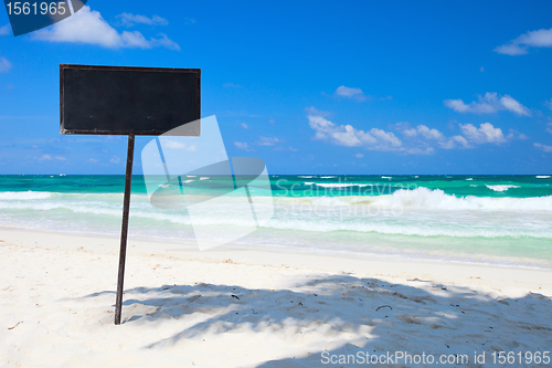 Image of Blank blackboard display on tropical beach