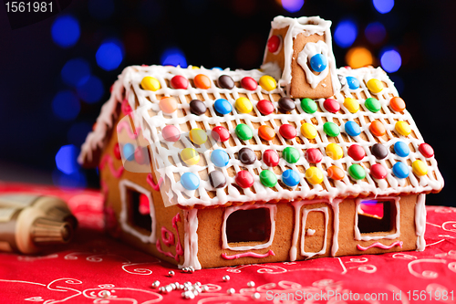 Image of Gingerbread house decorated with colorful candies