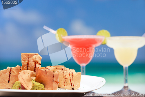 Image of Tortilla chips and margarita cocktails