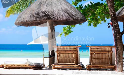 Image of Beach chairs on tropical coast