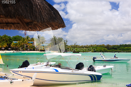 Image of Boats at tropical beach resort