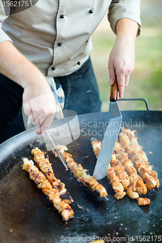 Image of Chef cooking meat