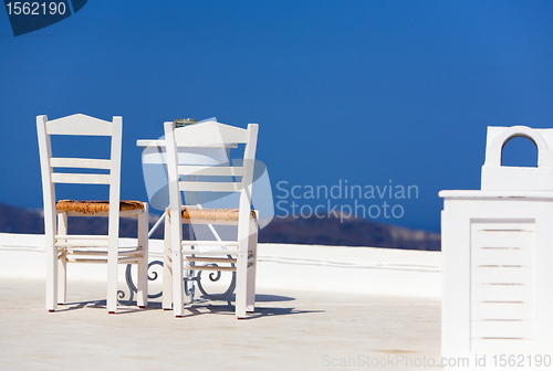 Image of White Chairs And Table