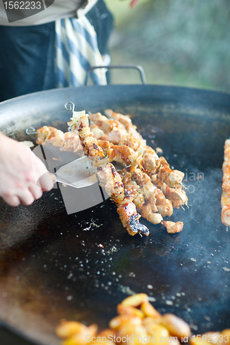 Image of Chef cooking meat