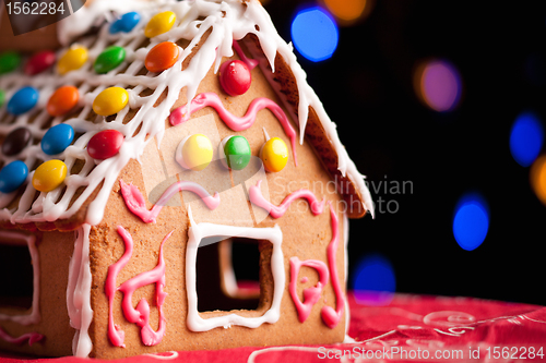 Image of Gingerbread house decorated with colorful candies