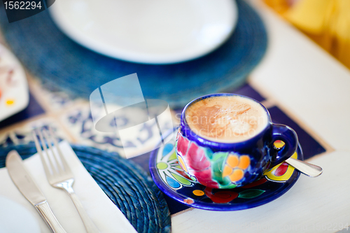 Image of Cappuccino served in colorful cup