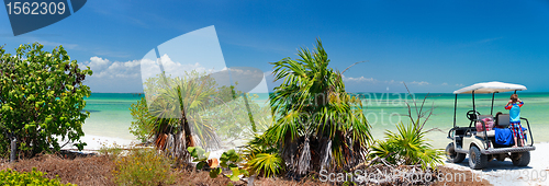 Image of Golf cart at tropical beach