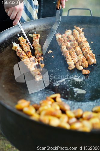 Image of Chef cooking meat