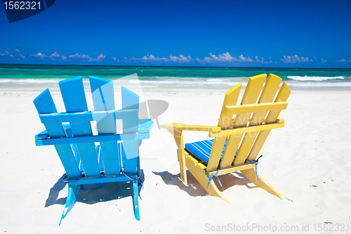 Image of Colorful chairs on beach