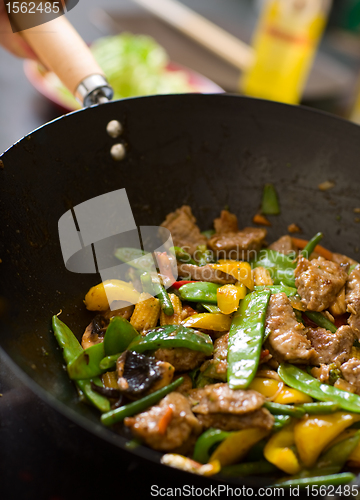 Image of Chef cooking wok