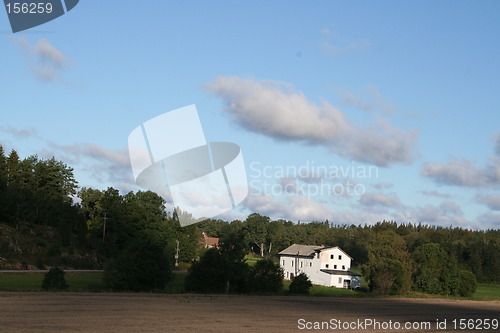 Image of Country view with white building