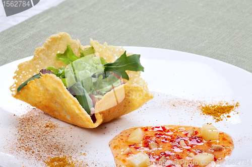 Image of Fresh light salad in parmesan cheese basket