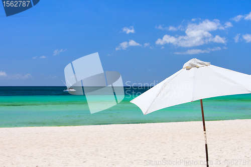 Image of White beach umbrella