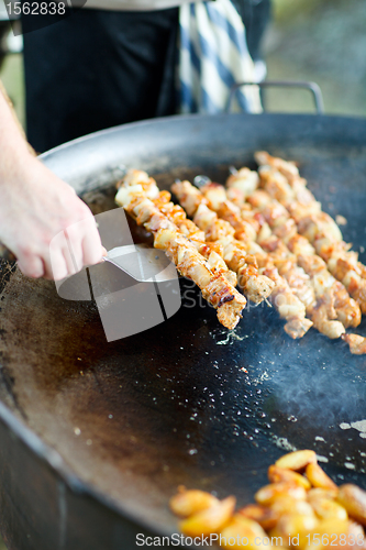 Image of Chef cooking meat