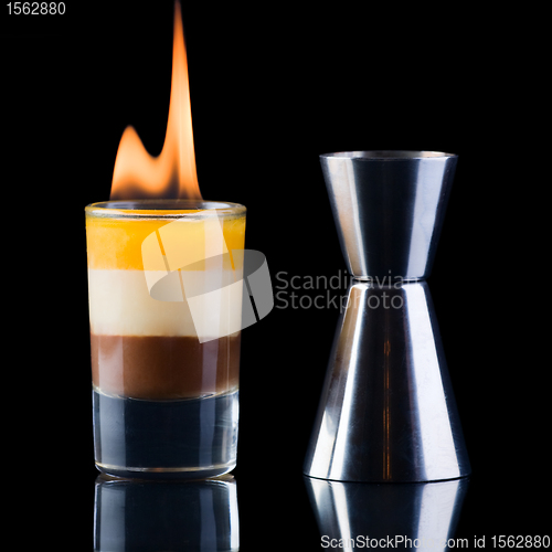 Image of B-52 Shot and measure glass over black background.