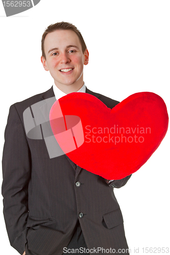 Image of Handsome man with red heart shaped pillow