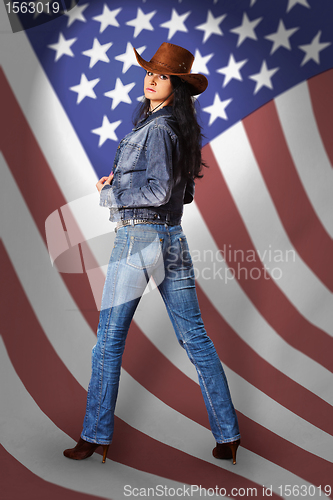 Image of Young woman in jeans with American flag