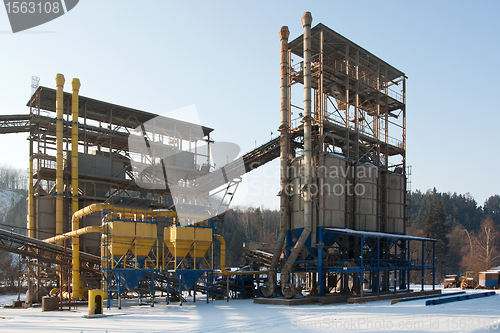 Image of Stone quarry with silos, conveyor belts in winter