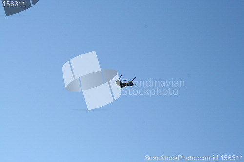 Image of Helicopter against blue sky