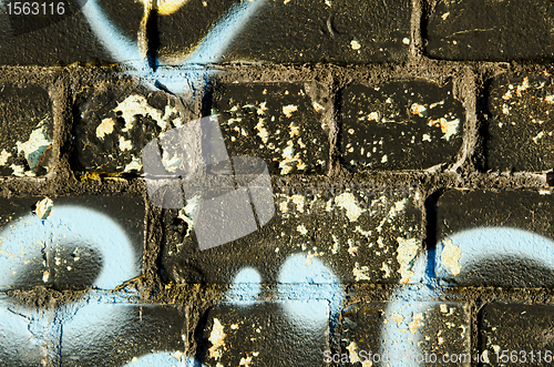 Image of Background closeup of graffitti painted brick wall 