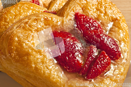 Image of flaky pastry heart with strawberries