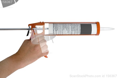 Image of Hand holding Caulking Gun with Caulk