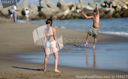 Image of Couple playing frisbee