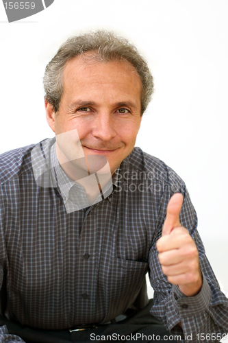 Image of Happy businessman thumbs up