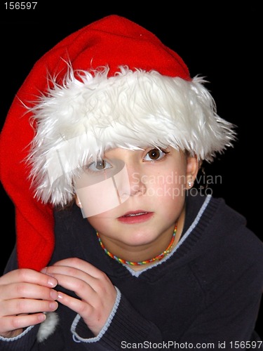 Image of Cute girl in a Christmas hat