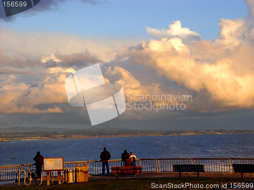 Image of People watching sunset