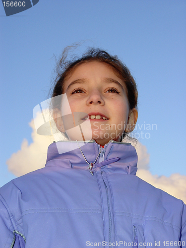 Image of Cute girl against the sky