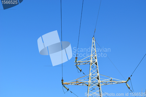 Image of electricity wire and pole in background blue sky 